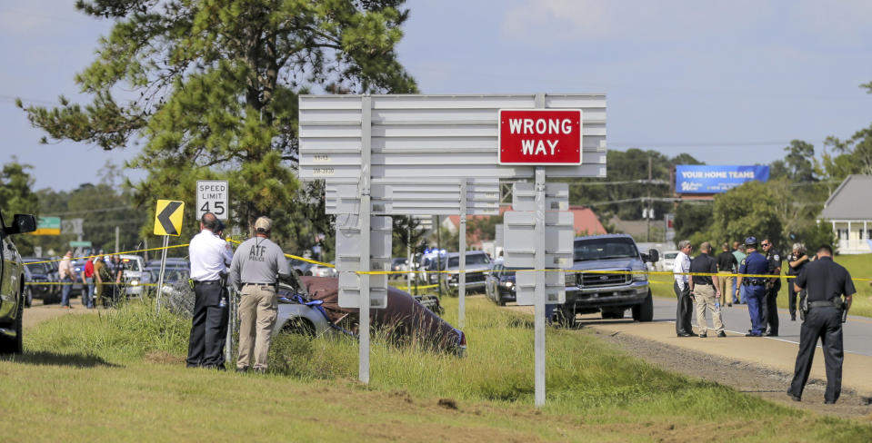 Two Mandeville police officers were shot after a vehicle chase, one fatally, near the U.S. 190 and Louisiana Highway 22 exit in Mandeville, La., Friday, Sept. 20, 2019. Mandeville Police Chief Gerald Sticker says one officer was killed and the other was wounded Friday but expected to survive the shooting in that community on the north shore of Lake Pontchartrain. The suspects are in custody. (David Grunfeld/The Advocate via AP)