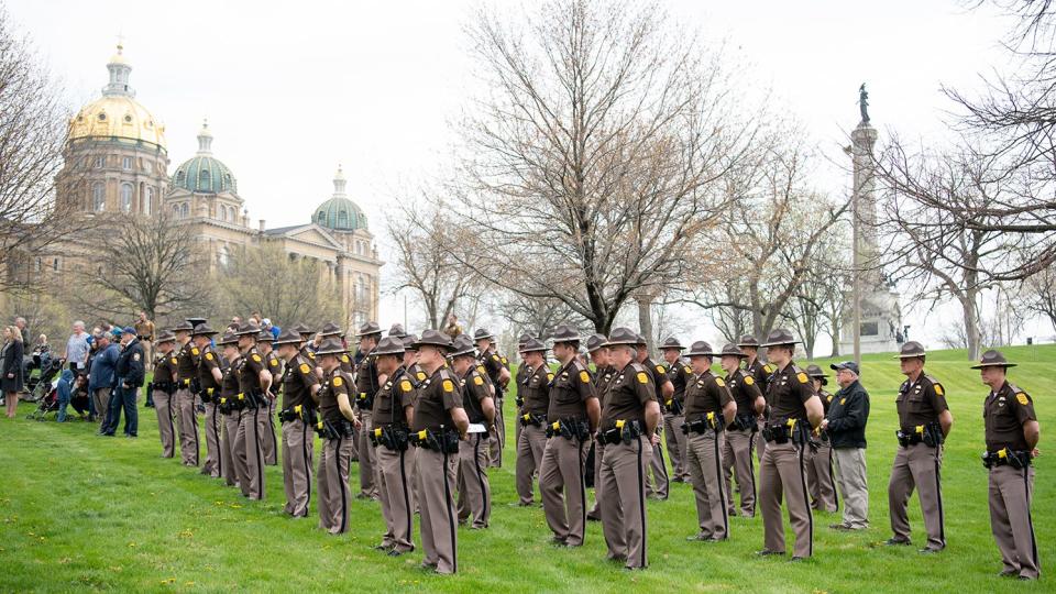 Members of the Iowa State Patrol stand during the 2022 Iowa Peace Officer Memorial Ceremony on the Oran Pape Office Building grounds on May 6.