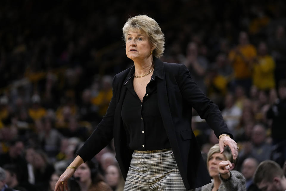 Iowa head coach Lisa Bluder watches from the bench during the first half of an NCAA college basketball game against Maryland, Thursday, Feb. 2, 2023, in Iowa City, Iowa. (AP Photo/Charlie Neibergall)