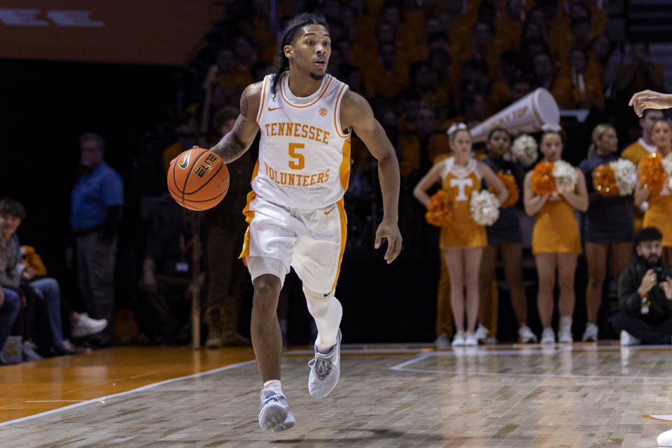 Tennessee guard Zakai Zeigler (5) drives the ball up court during the first half of an NCAA college basketball game against George Mason Tuesday, Dec. 5, 2023, in Knoxville, Tenn. (AP Photo/Wade Payne)