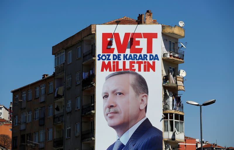 FILE PHOTO: A billboard carrying a picture of Turkish President Erdogan is seen on a building in Istanbul