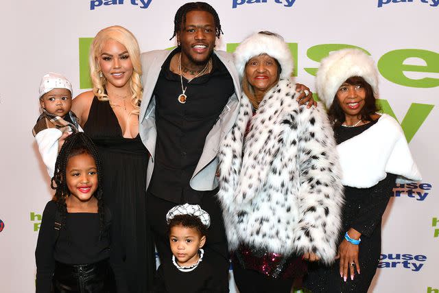 <p>Paras Griffin/Getty</p> (L-R) Jacky Oh, DC Young Fly and family attend the 'House Party' Red Carpet Screening at Regal Atlantic Station on January 06, 2023 in Atlanta, Georgia