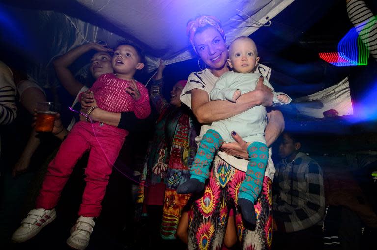 Eleven-month-old Phoenix enjoys the music and entertainment at the Big Fish Little Fish "2-4 Hour Party People" event in Brixton, South London, on April 12, 2014