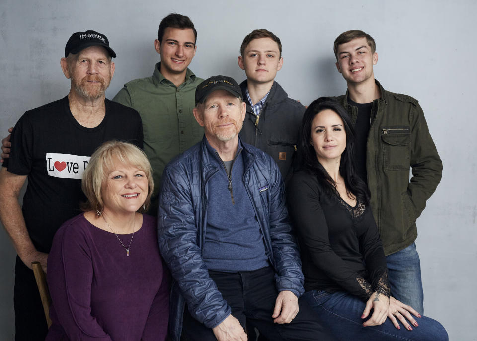 Steve (Woody) Culleton, from left, Bryson Groh, Zach Boston, Brandon Burke, Michelle John, from bottom right, director Ron Howard and Carly Jean Ingersoll pose for a portrait to promote the film "Rebuilding Paradise" at the Music Lodge during the Sundance Film Festival on Friday, Jan. 24, 2020, in Park City, Utah. (Photo by Taylor Jewell/Invision/AP)