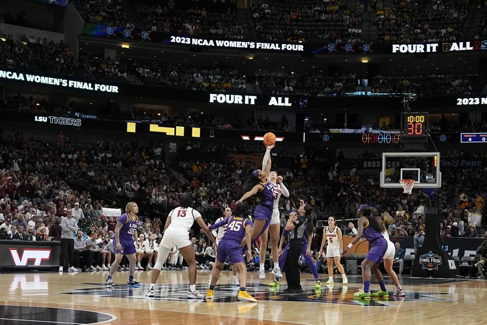 The opening tip during the first half of an NCAA Women's Final Four semifinals basketball game between LSU and Virginia Tech Friday, March 31, 2023, in Dallas. (AP Photo/Darron Cummings)