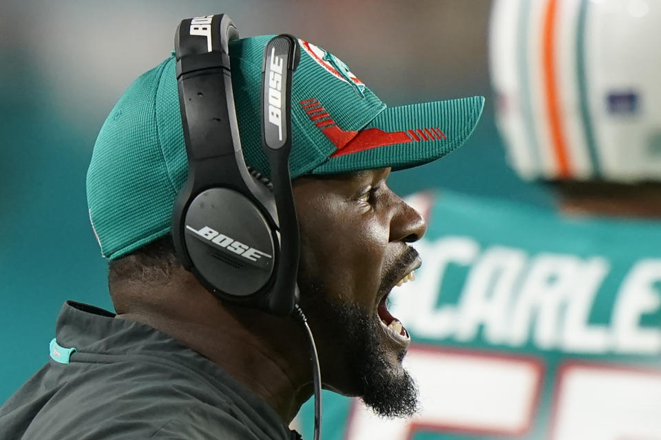 Miami Dolphins head coach Brian Flores shouts from the sidelines during the second half of an NFL football game against the New England Patriots, Sunday, Jan. 9, 2022, in Miami Gardens, Fla. (AP Photo/Wilfredo Lee)