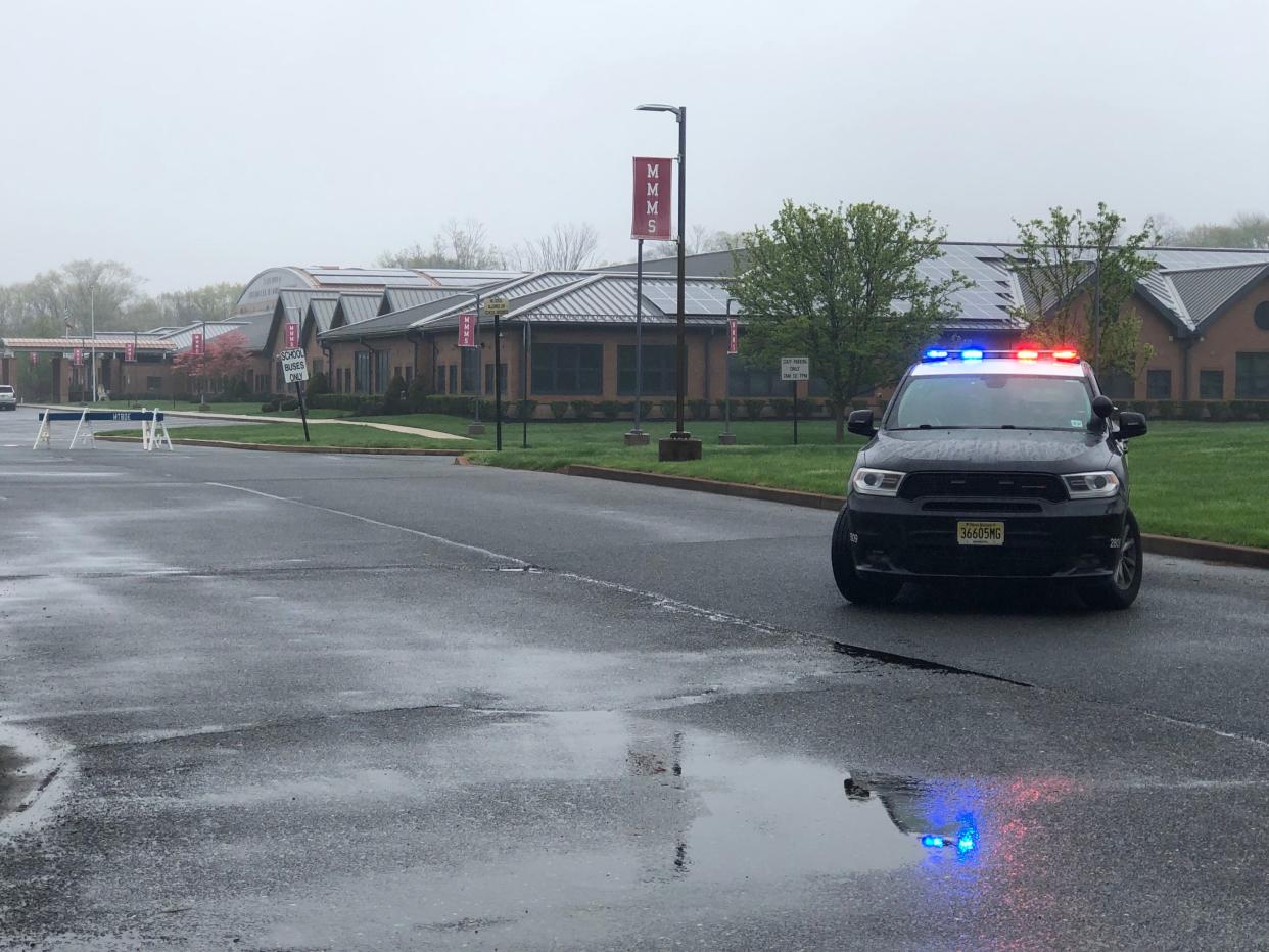 A police car sits in front of the Marlboro Middle School after a bomb threat on Thursday morning April 18,2024