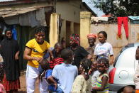 Guinean wrestler Fatoumata Yarie Camara is welcomed by family members as she arrives at her house in Conakry, Guinea, Monday July 19, 2021. A West African wrestler's dream of competing in the Olympics has come down to a plane ticket. Fatoumata Yarie Camara is the only Guinean athlete to qualify for these Games. She was ready for Tokyo, but confusion over travel reigned for weeks. The 25-year-old and her family can't afford it. Guinean officials promised a ticket, but at the last minute announced a withdrawal from the Olympics over COVID-19 concerns. Under international pressure, Guinea reversed its decision. (AP Photo/Youssouf Bah)