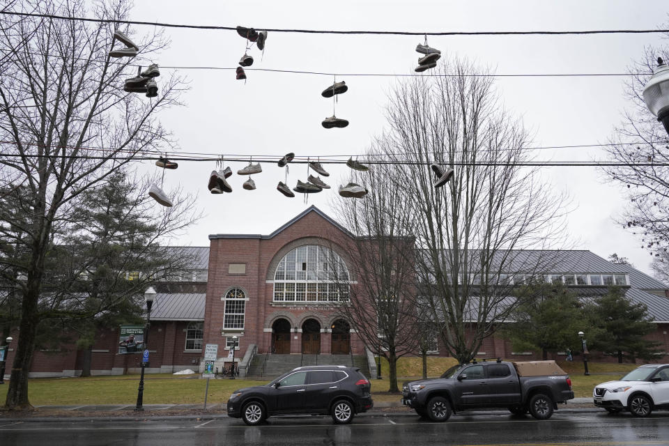 Sneakers hang on utility lines near Alumni Gymnasium on the campus of Dartmouth College, Tuesday, March 5, 2024, in Hanover, N.H. Dartmouth basketball players voted to form a union, an unprecedented step in the continued deterioration of the NCAA's amateur business model. (AP Photo/Robert F. Bukaty)