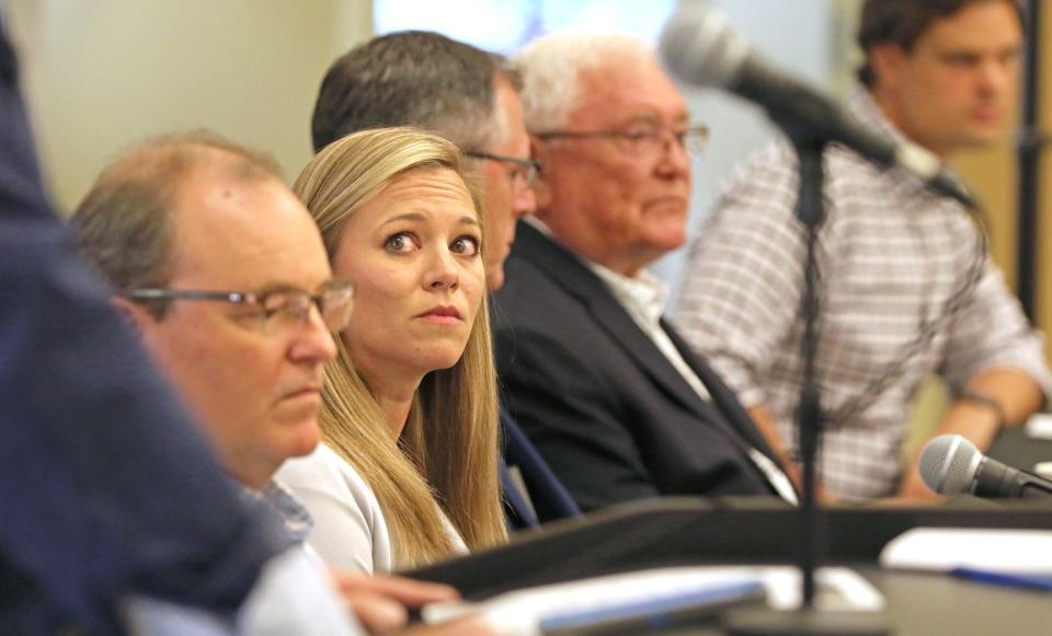 Mary Beth Martin and other members of the panel listen to Steve Johnson talk during a press conference about the inaugural Earl Scruggs Music Festival that is coming to Tryon International Equestrian Center.
