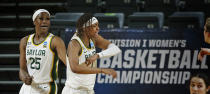 Baylor forward NaLyssa Smith (1) celebrates after blocking a shot as teammate Baylor center Queen Egbo (25) watches during the first half of a college basketball game against Virginia Tech in the second round of the women's NCAA tournament at the Greehey Arena in San Antonio, Tuesday, March 23, 2021. (AP Photo/Ronald Cortes)