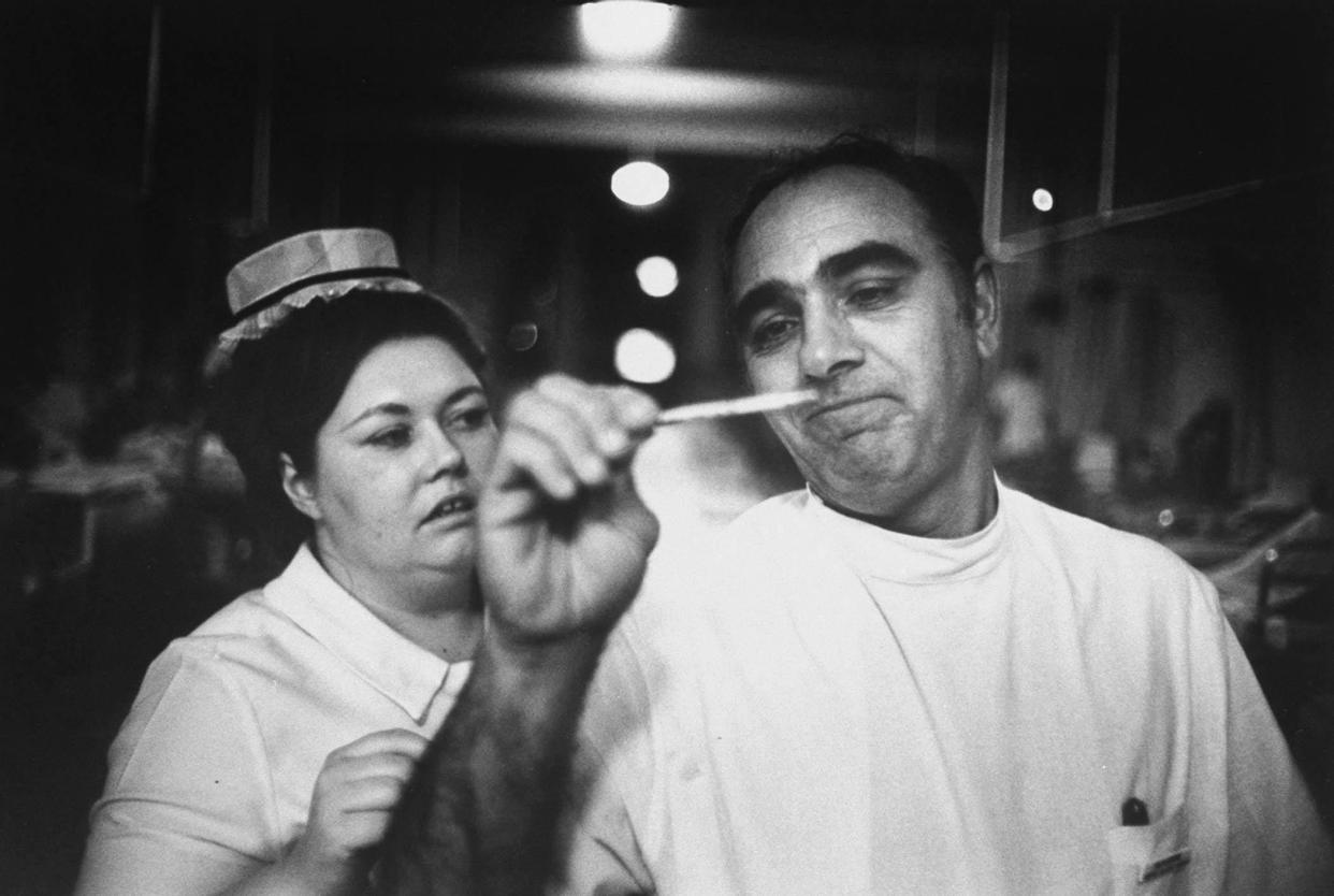 Policeman Michael Garone (R) during nursing training at Hunter College.  [GREY VILLET/The LIFE Picture Collection via Getty Images)