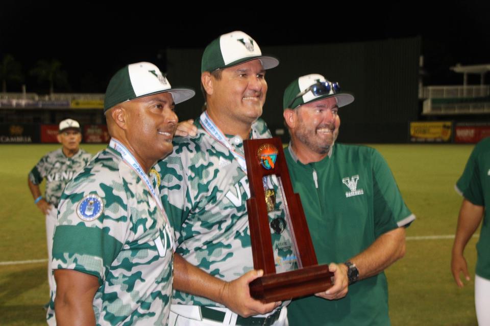 Venice High pitching coach Jeff Callan, right, poses with Venice coach Jose Velez and Venice head baseball coach Craig Faulkner on June 26, 2019, in Fort Myers.