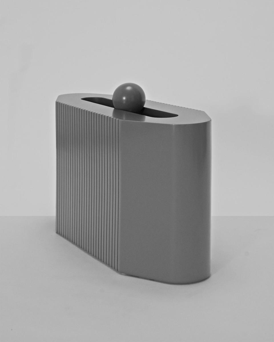 This slick object, titled Linn, adds sophistication to any room.