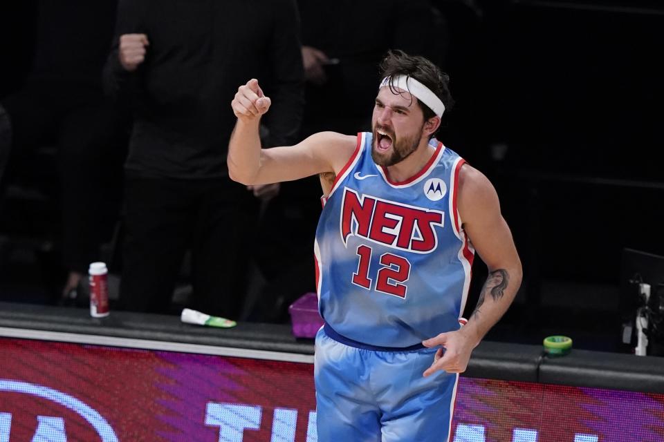 Brooklyn Nets' Joe Harris reacts after making a 3-point basket during the first half of the team's NBA basketball game against the Philadelphia 76ers on Thursday, Jan. 7, 2021, in New York. (AP Photo/Frank Franklin II)