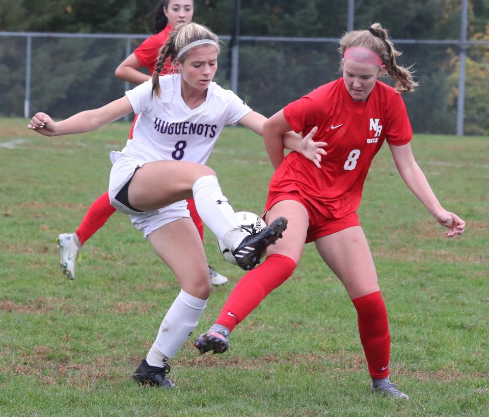 North Rockland's Megan McGovern, right, fights for the ball with New Rochelle's Alexandra Rivera during their Section 1 Class AA quarterfinalat at North Rockland Oct. 24, 2022. North Rockland advances on penalty kicks 3-2, after the teams tied 1-1.