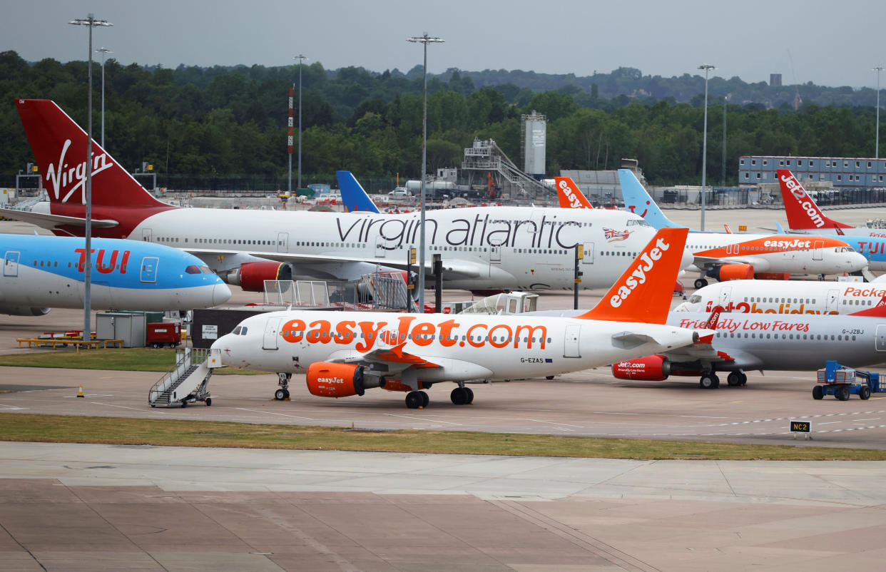 Easyjet, Virgin Atlantic and TUI Airways aircraft are seen at Manchester Airport, following the outbreak of the coronavirus disease (COVID-19), Manchester, Britain, June 8, 2020. REUTERS/Phil Noble