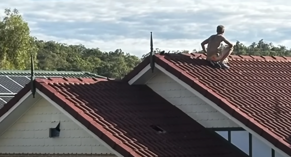 The man pictured sitting on the rood in broad daylight. 