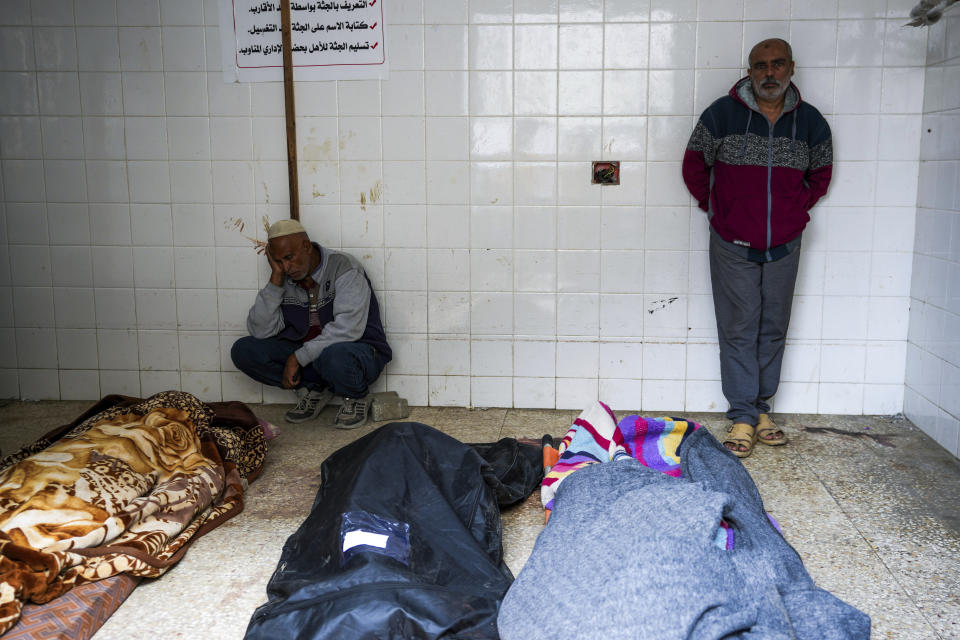 Mourners react next to the bodies of Palestinians who were killed in an Israeli airstrike in Gaza Stirp, at the Al Aqsa hospital in Deir al Balah, Gaza, Thursday, May 2, 2024. (AP Photo/Abdel Kareem Hana)