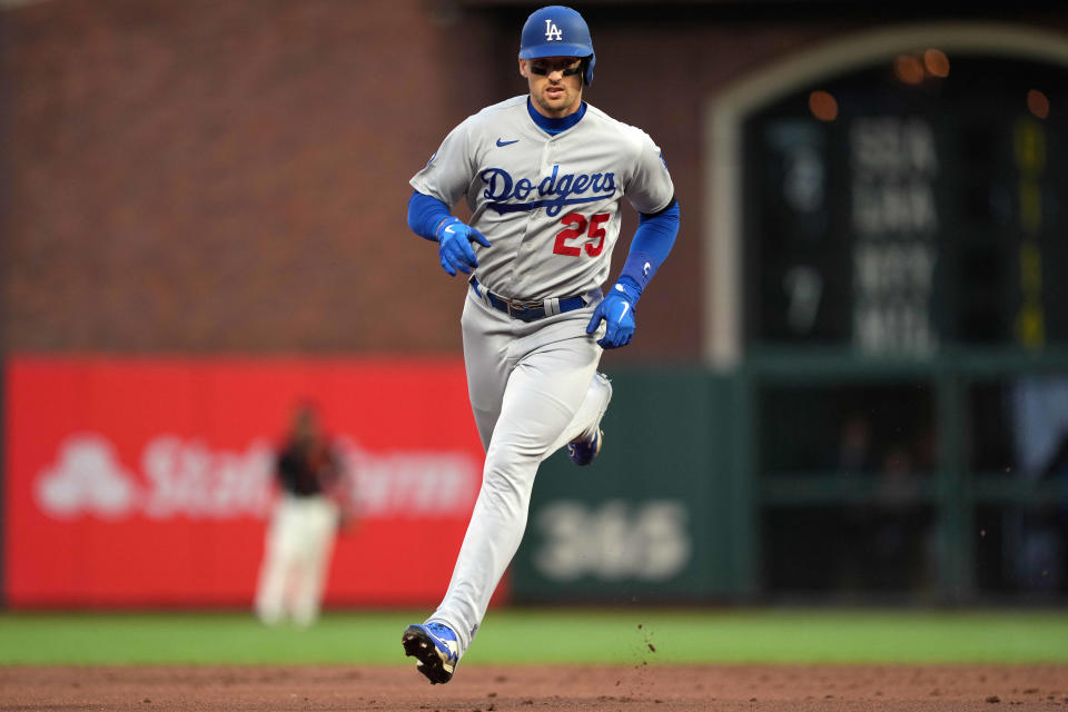 Dodgers outfielder Trayce Thompson rounds the bases after hitting a home run against the Giants.