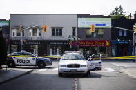 <p>Police are shown at the perimeter of the scene of a shooting in east Toronto, on July 23, 2018. Police were trying Monday to determine what prompted a 29-year-old man to go on a shooting rampage in a popular Toronto neighborhood. (Photo: Christopher Katsarov/The Canadian Press via AP) </p>