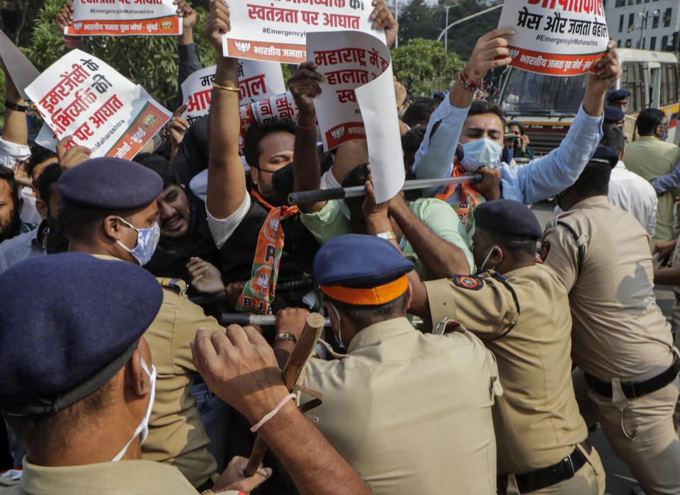 Police detain Bharatiya Janata party workers protesting against Maharashtra state government for the arrest of television news anchor Arnab Goswami in Mumbai, India, Wednesday, Nov. 4, 2020. Indian police on Wednesday said they arrested the Republic TV founder and charged him with abetment to suicide in connection with the 2018 deaths of an interior designer and the designer's mother. (AP Photo/Rajanish Kakade)