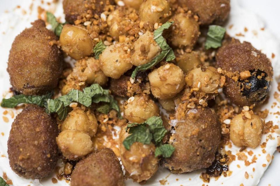 Signature: Labneh with fried olives, chickpeas and morita chilli (Daniel Hambury/Stella Pictures)