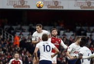 <p>Arsenal’s Shkodran Mustafi, centre, heads the ball to score his side’s opening goal</p>