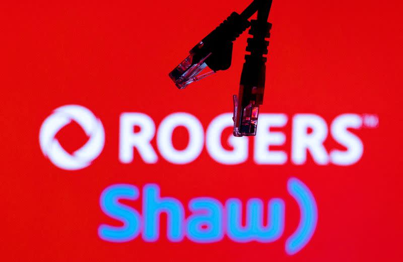 FILE PHOTO: Illustration shows Rogers and Shaw Communications logos