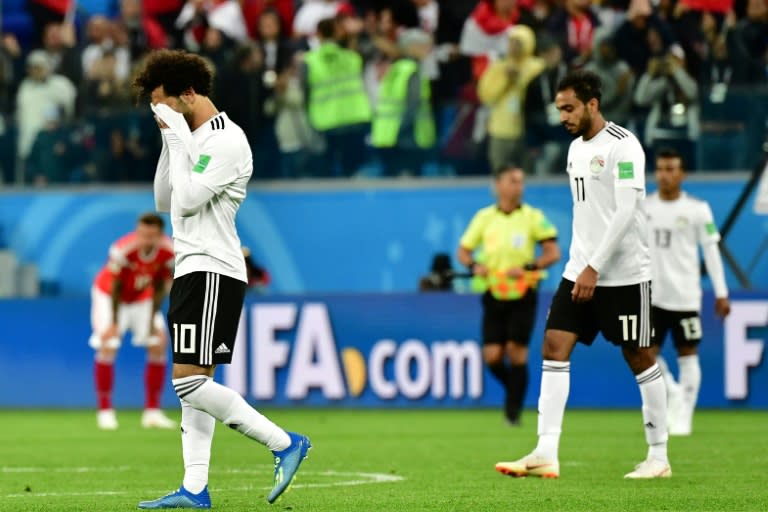 Mohamed Salah (L) and Egypt endured a difficult night against Russia and are already staring at the World Cup exit door