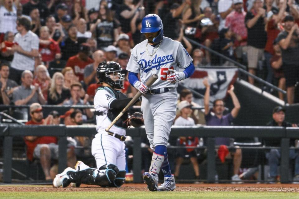 Dodgers' Mookie Betts walks to the dugout after striking out in Game 3 against the Arizona Diamondbacks on Oct. 11, 2023.