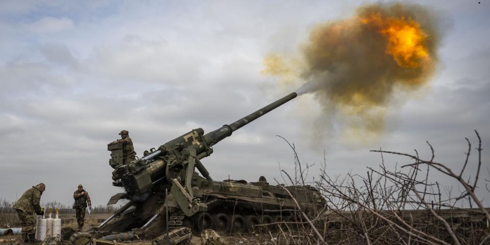 A Ukrainian serviceman fires a cannon.