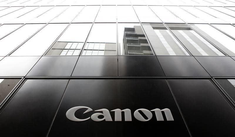 A logo of Canon Inc is pictured at the company's showroom in Tokyo October 24, 2013. REUTERS/Yuya Shino/Files