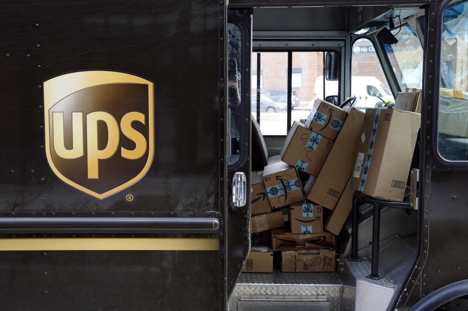 FILE- In this Dec. 19, 2018, file photo packages await delivery inside of a UPS truck in Baltimore. United Parcel Service Inc. reports financial results Thursday, Jan. 31, 2019. (AP Photo/Patrick Semansky, File)