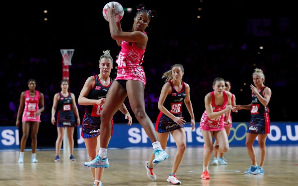 Adean Thomas of The London Pulse jumps for the ball during the Vitality Netball Superleague Season Opener game between London Pulse and Strathclyde Sirens at Arena Birmingham - Luke Walker/Getty Images for England Netball