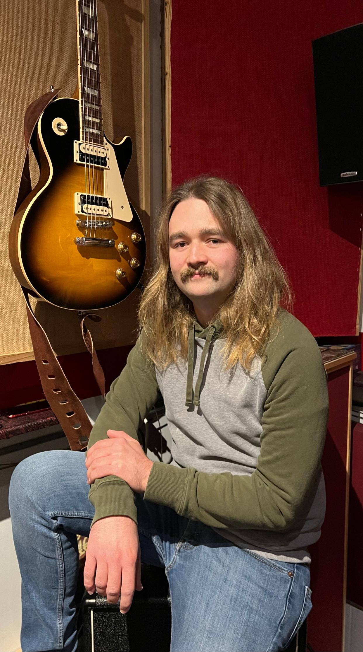 Jake Buckridge plays guitar and sings for Beach City Postal Service, a Stark County rock band that will be performing on March 16 in a Neil Young tribute concert at The Auricle in downtown Canton.