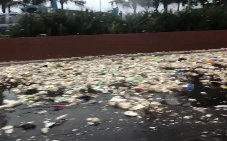 Waves of rubbish crash into Manila after monsoon washes city garbage into sea