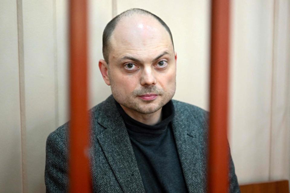 Kara-Murza sits on a bench inside a defendants’ cage during a hearing at the Basmanny court in Moscow today (AFP/Getty)