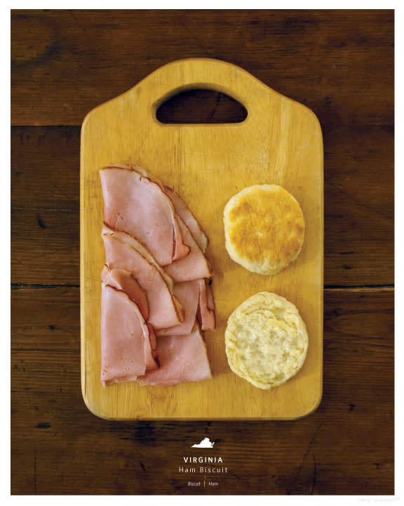 Perfectly folded Virginia ham and a biscuit is the food that represents the state in this photo.