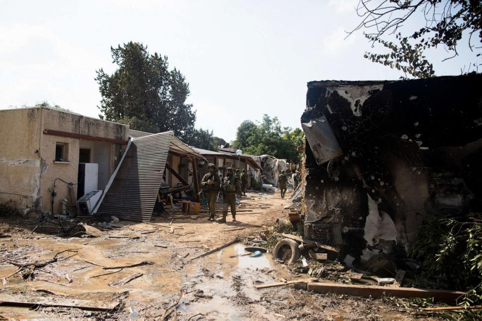 Israeli soldiers patrol near burned houses after an attack by Palestinian militants on this kibbutz near the borde with Gaza on Oct. 10, 2023 in Kfar Gaza, Israel. (Amir Levy/Getty Images)