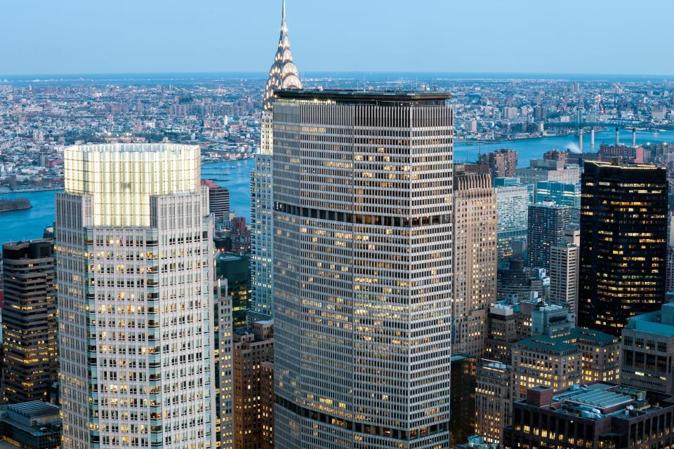 <h1 class="title">New York, Midtown Manhattan Skyscrapers Illuminated at Dusk</h1><cite class="credit">Photo: Getty Images</cite>