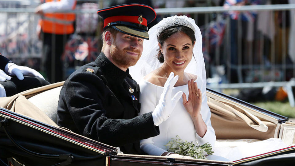 Meghan Markle and Prince Harry in a carraige on their wedding day