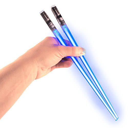 <p><strong>ChopSabers</strong></p><p>amazon.com</p><p><strong>$11.97</strong></p><p><a href="https://www.amazon.com/dp/B01CA2HOZ4?tag=syn-yahoo-20&ascsubtag=%5Bartid%7C10055.g.28649116%5Bsrc%7Cyahoo-us" rel="nofollow noopener" target="_blank" data-ylk="slk:Shop Now;elm:context_link;itc:0;sec:content-canvas" class="link ">Shop Now</a></p><p>May the force be with you ... at dinner time. Fans of the sci-fi franchise are bound to take great pride in these light-up utensils.</p>