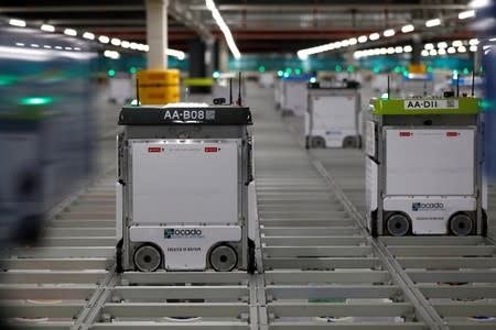 FILE PHOTO: "Bots" are seen on the grid of the "smart platform" at the Ocado CFC (Customer Fulfilment Centre) in Andover