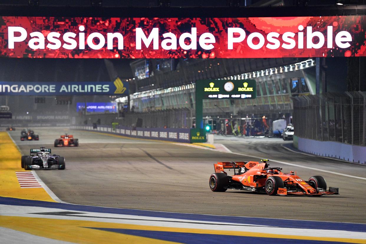 Ferrari's Monegasque driver Charles Leclerc (right) takes part in the Formula One Singapore Grand Prix night race at the Marina Bay Street Circuit in Singapore on 22 September, 2019. (PHOTO: AFP via Getty Images)