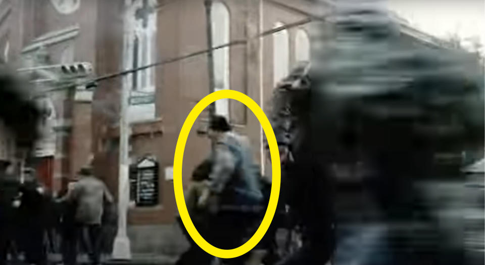The back view of Channing running down the street is circled