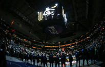 An image of Kobe Bryant is displayed above the American Airlines Center during a moment of silence before an NBA basketball game between the Phoenix Suns and the Dallas Mavericks Tuesday, Jan. 28, 2020, in Dallas. Bryant and his daughter were among nine people killed Sunday in a California helicopter crash. (AP Photo/Ron Jenkins)