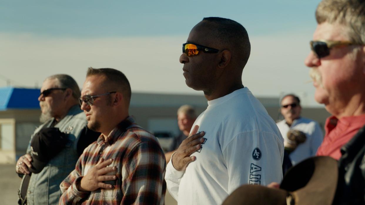 Derrick Wilburn, center, and other participants pause at a Freedom Ride Rally in Cortez, Colorado, in a scene from the documentary "One Person, One Vote."