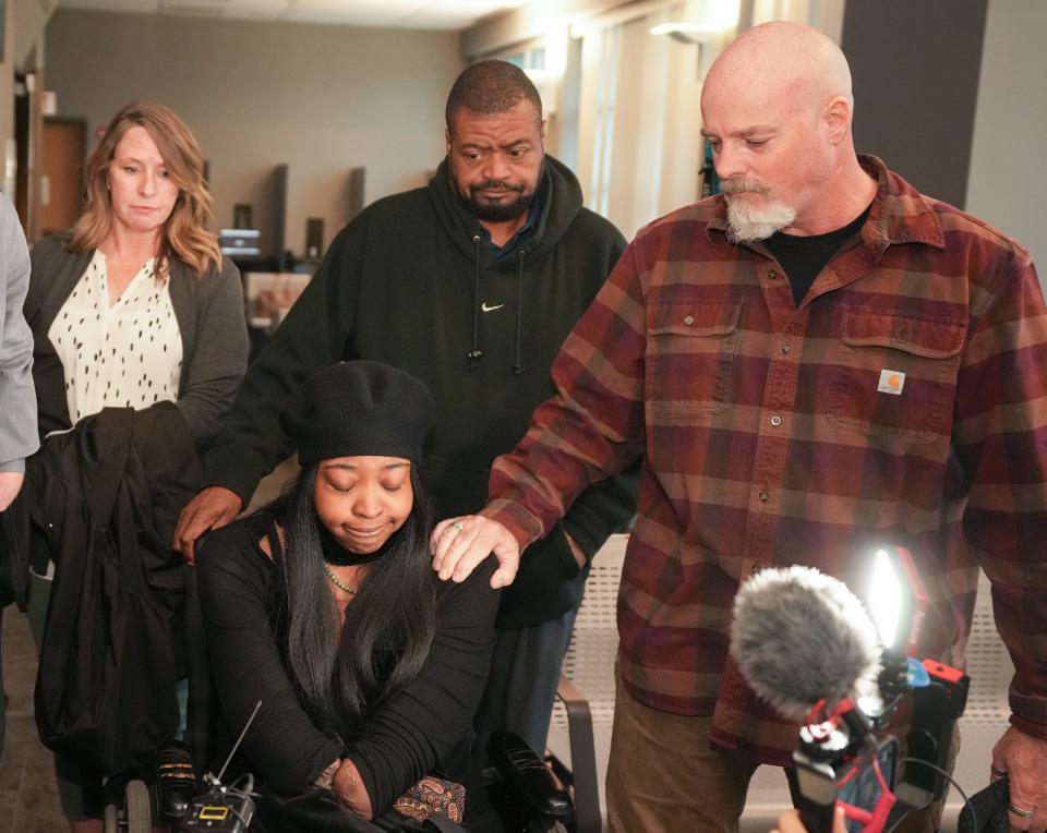 Stephen Foster, right, the father of Garrett Foster, comforts Garretts wife, Whitney Mitchell, on Friday after Daniel Perry was convicted of murder in Garrett Foster's 2020 shooting death.