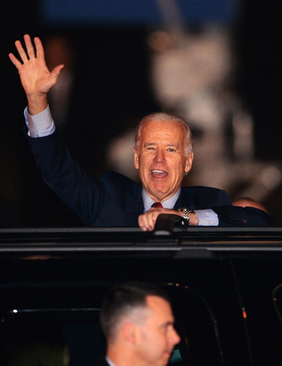 US Vice President Joe Biden waves upon his arrival at the Tokyo International Airport on December 1, 2013 on the first leg of his Asian tour. Biden will meet with Japanese leaders, with Tokyo hoping for some fulsome backing in its vicious territorial spat with China.